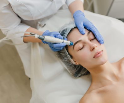 view-from-rejuvenation-beautiful-woman-enjoying-cosmetology-procedures-beauty-salon-dermatology-hands-blue-glows-healthcare-therapy-botox (1)